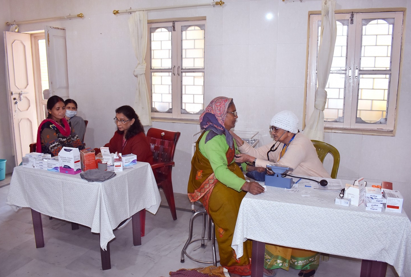 General Physicians examining patients.